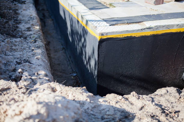 Professional Basement Waterproofing technician working in Jerry City, OH